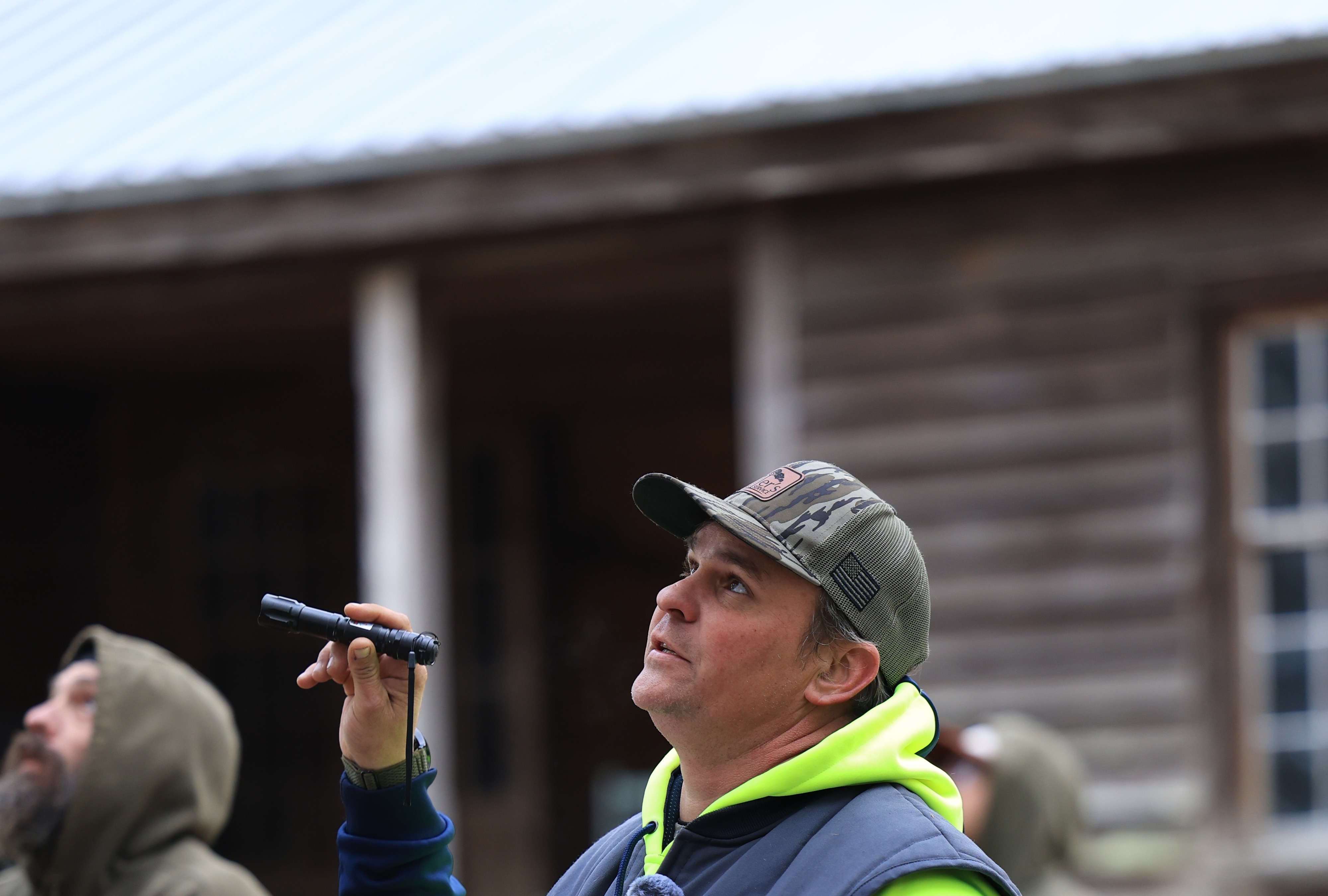 Tim Walters judging competitors at Miller's Tree Service Annual Climbing Competition
